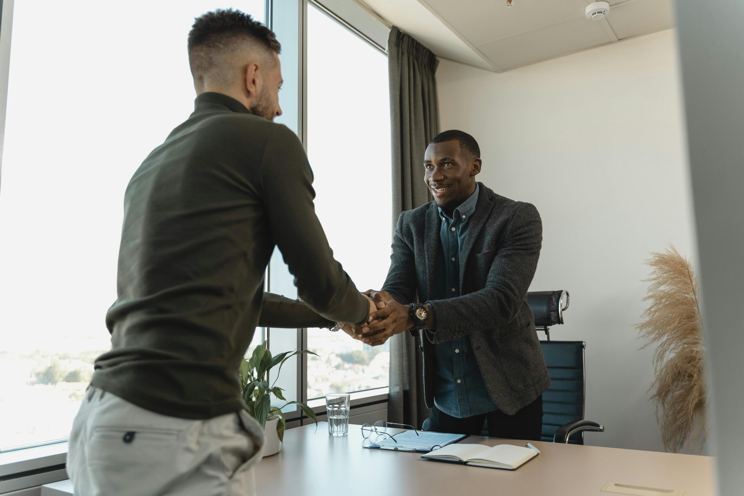 Two businessmen shaking hands during a professional meeting